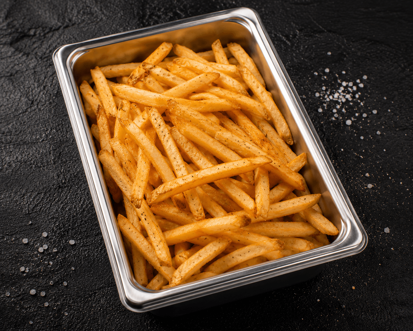 Papas a la francesa Juanberto's — crujientes por fuera, suaves por dentro, fritas justo antes de ensamblar el burrito